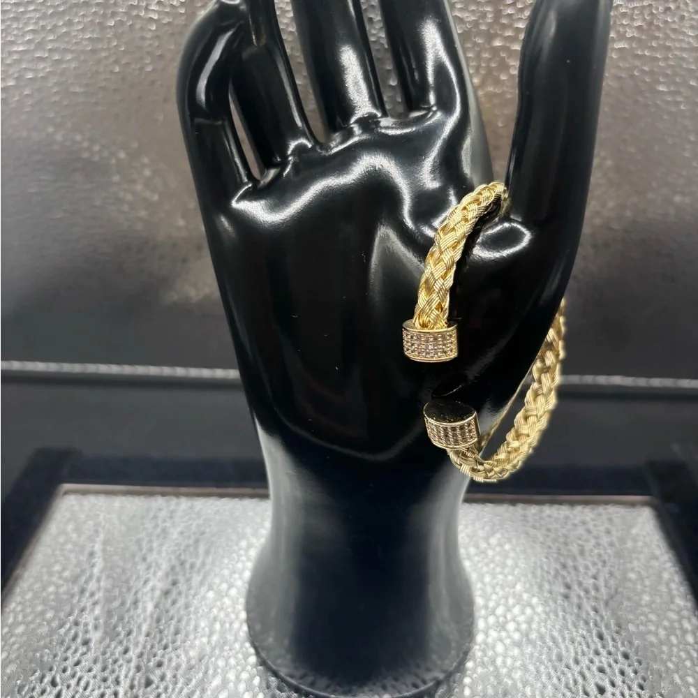 Elegant Gold Braided Also Adjustable Bangle .